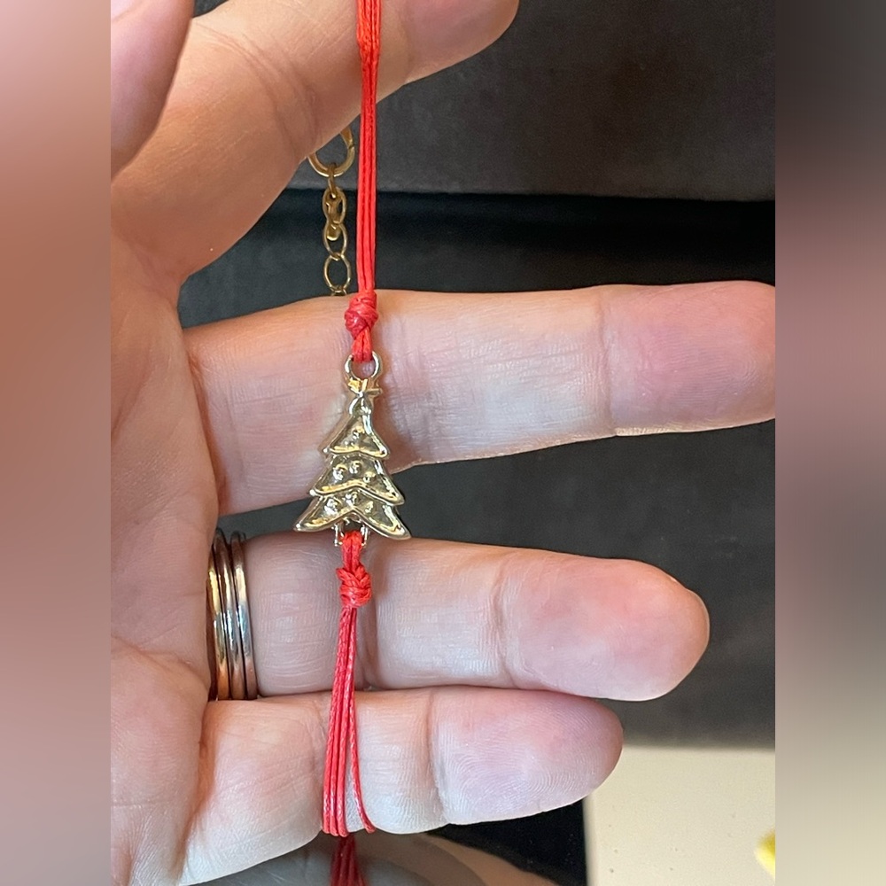 Red leather string bracelet with a Christmas tree charm